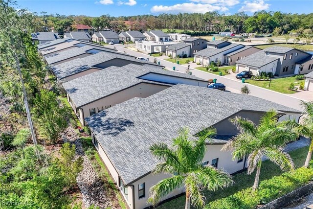 birds eye view of property with a residential view