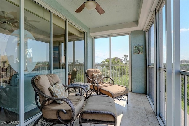 sunroom featuring ceiling fan