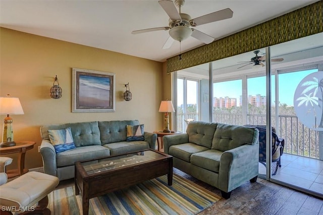 living room with hardwood / wood-style flooring and ceiling fan