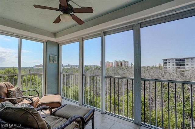 sunroom featuring a wealth of natural light and ceiling fan