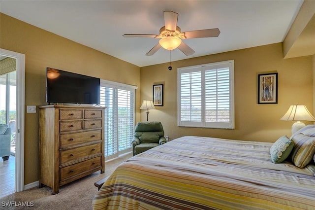 bedroom featuring light carpet and ceiling fan