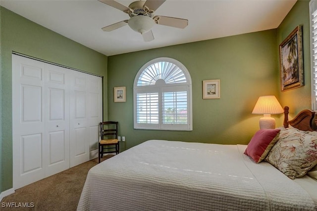 carpeted bedroom featuring a closet and ceiling fan