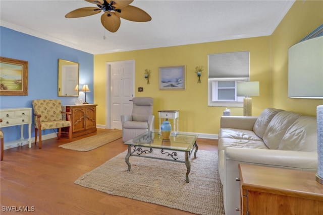 living room with ornamental molding and hardwood / wood-style floors