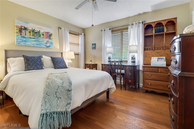 bedroom with hardwood / wood-style floors and ceiling fan