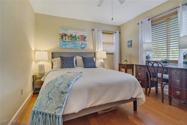 bedroom featuring hardwood / wood-style flooring and ceiling fan