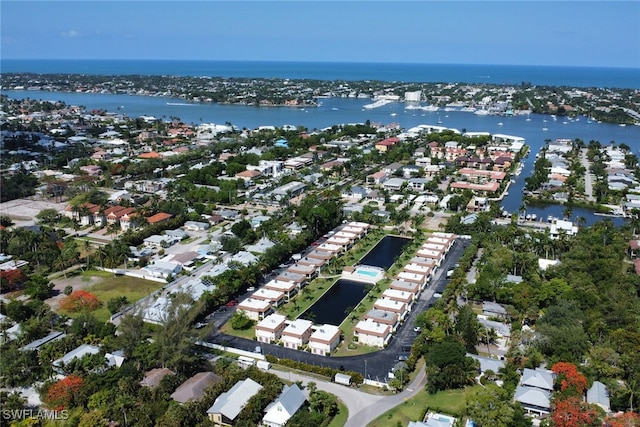 birds eye view of property featuring a water view