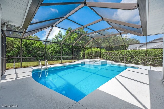 view of pool featuring a lanai, an in ground hot tub, and a patio