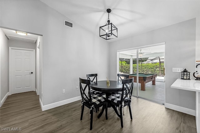 dining room with dark hardwood / wood-style flooring, pool table, and vaulted ceiling