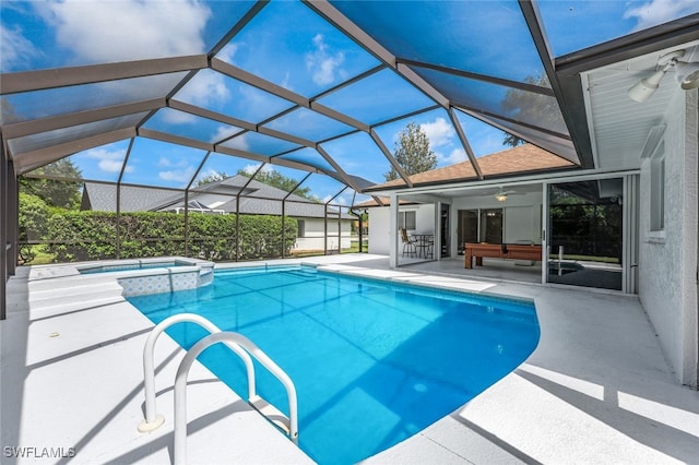 view of swimming pool featuring a lanai, an in ground hot tub, ceiling fan, and a patio