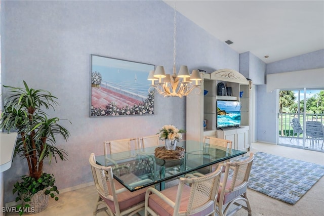 dining area featuring a chandelier and high vaulted ceiling