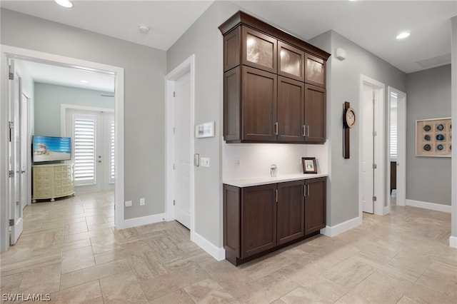 corridor featuring light tile patterned flooring