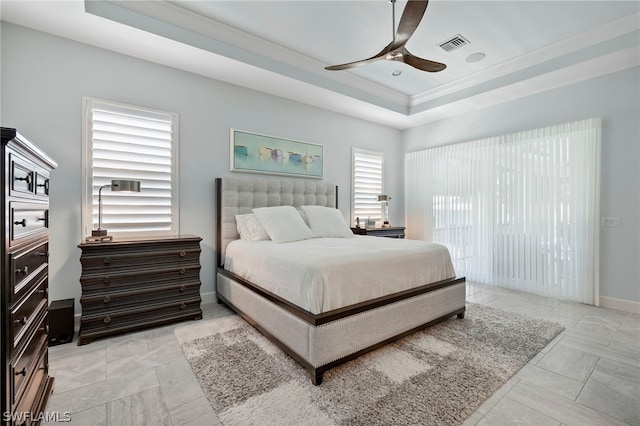 bedroom featuring light tile patterned floors, a raised ceiling, and ceiling fan