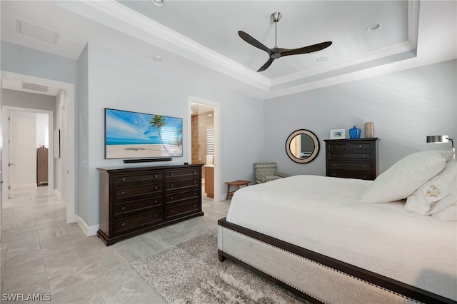 tiled bedroom with a tray ceiling and ceiling fan