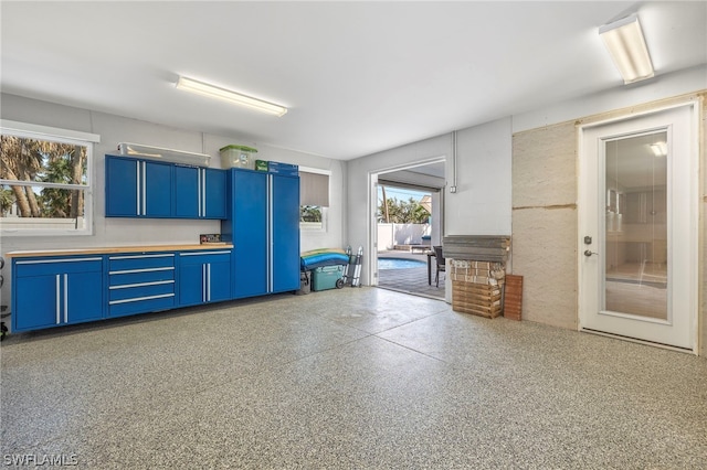 kitchen with blue cabinets and a wealth of natural light