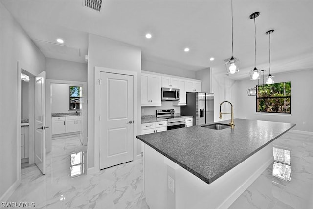 kitchen featuring visible vents, marble finish floor, stainless steel appliances, and a sink