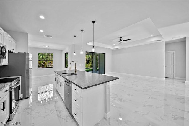 kitchen with a sink, recessed lighting, a ceiling fan, and stainless steel appliances