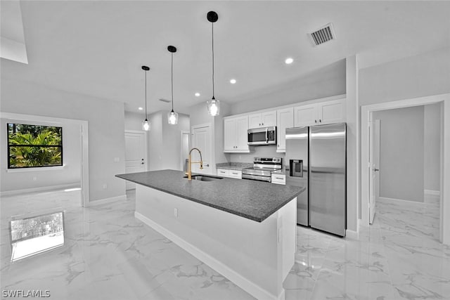 kitchen with visible vents, a sink, appliances with stainless steel finishes, dark countertops, and marble finish floor