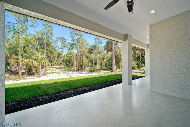 view of patio featuring ceiling fan