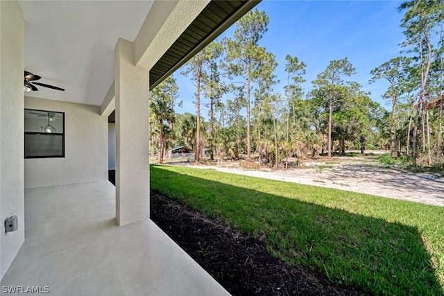 view of yard featuring ceiling fan