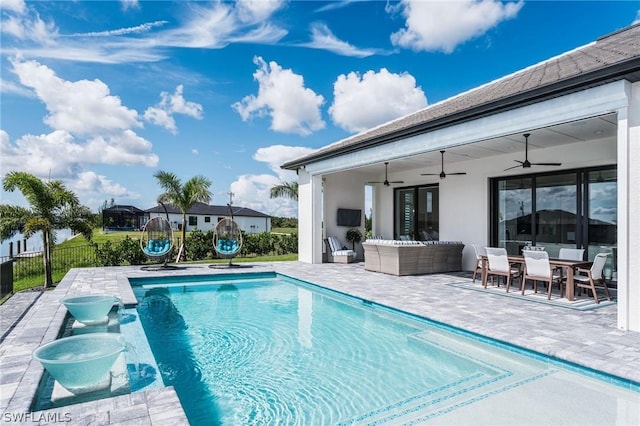 view of swimming pool featuring an outdoor hangout area, ceiling fan, and a patio area