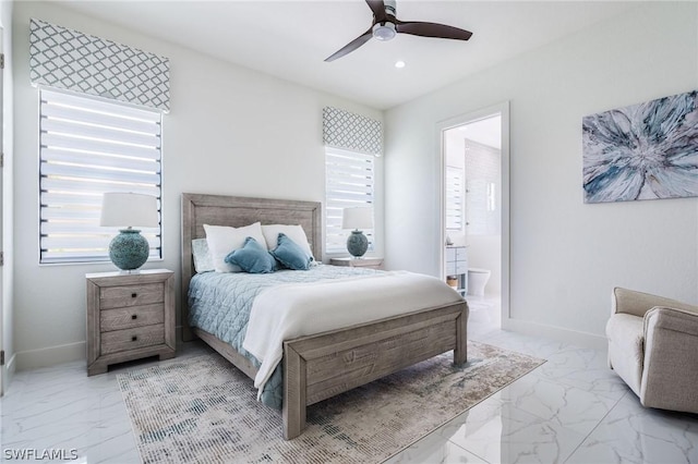 bedroom with multiple windows, ensuite bath, and ceiling fan