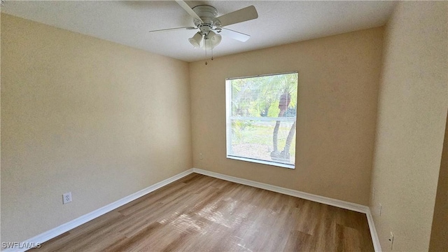 unfurnished room with ceiling fan and light hardwood / wood-style floors