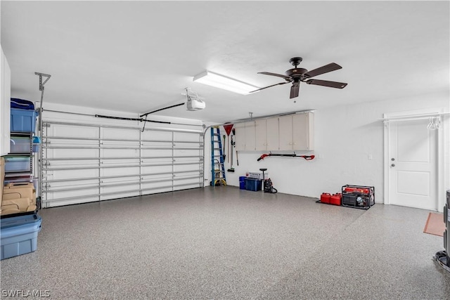 garage featuring ceiling fan and a garage door opener