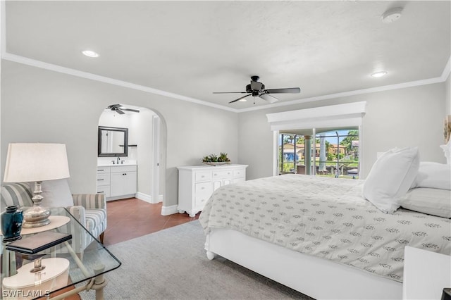 bedroom with connected bathroom, ornamental molding, ceiling fan, and light tile patterned flooring