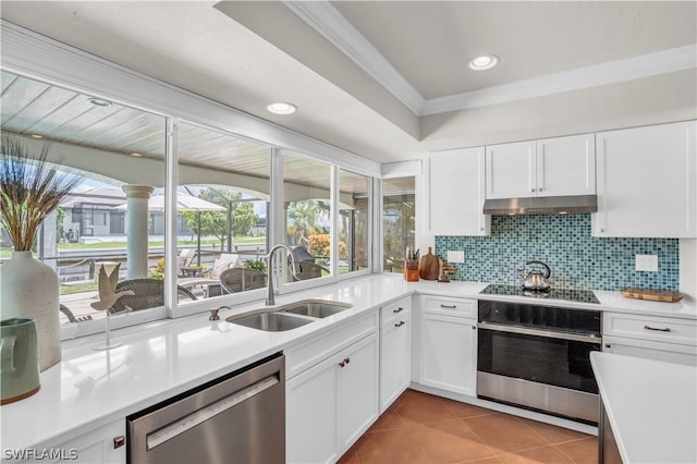 kitchen featuring sink, dishwasher, tasteful backsplash, white cabinets, and oven