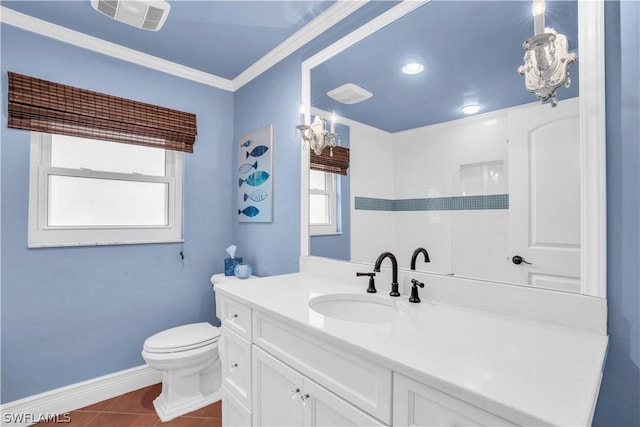 bathroom with crown molding, vanity, tile patterned floors, and toilet