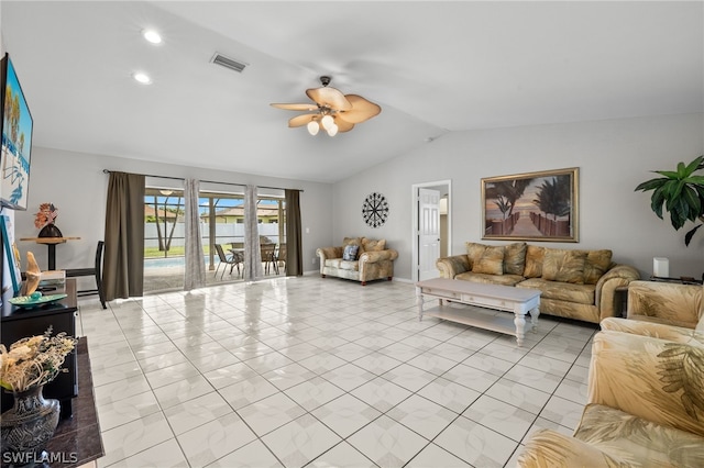 tiled living room with ceiling fan and vaulted ceiling