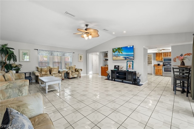 living room with ceiling fan, lofted ceiling, visible vents, and baseboards