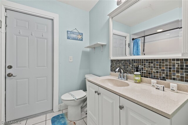 full bath featuring a shower with curtain, tasteful backsplash, toilet, vanity, and tile patterned flooring