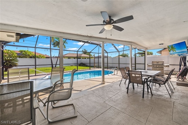 view of pool with a patio, ceiling fan, and area for grilling