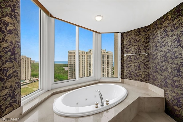 full bathroom featuring wallpapered walls and a jetted tub