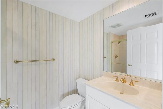 full bath featuring visible vents, a shower stall, vanity, and toilet