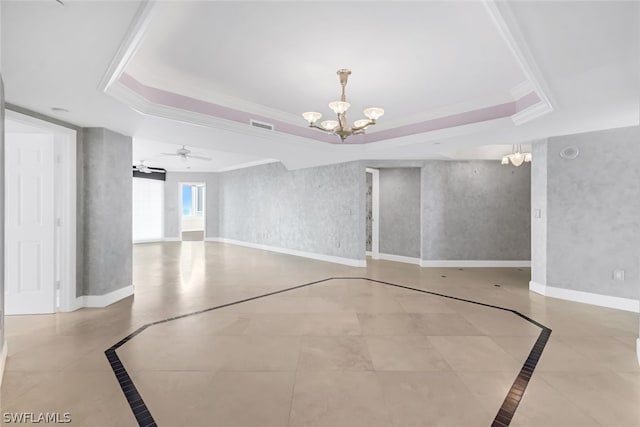 spare room featuring visible vents, ceiling fan with notable chandelier, a tray ceiling, wallpapered walls, and baseboards