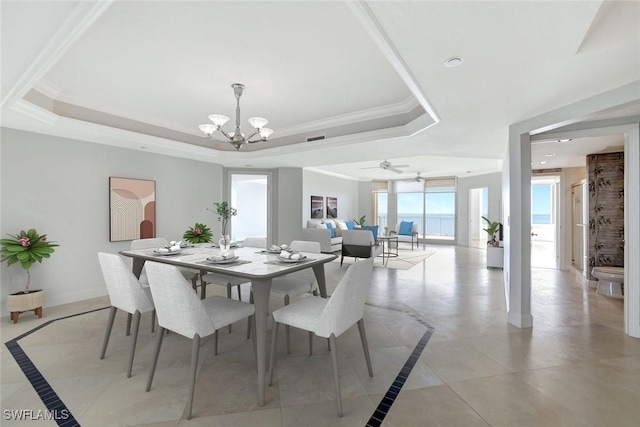 dining space featuring visible vents, baseboards, ornamental molding, a raised ceiling, and a notable chandelier