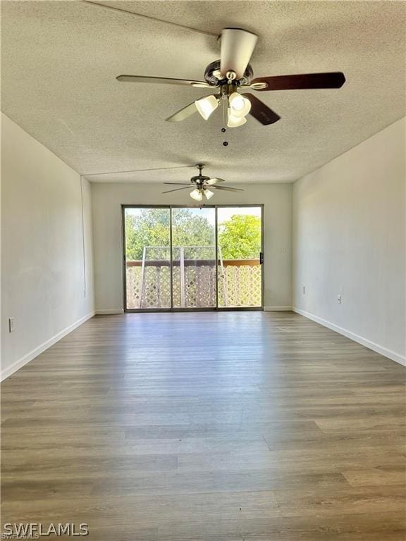 unfurnished room featuring hardwood / wood-style floors, a textured ceiling, and ceiling fan