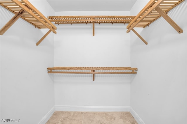 walk in closet featuring light tile patterned floors