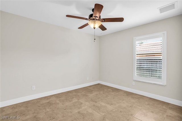 spare room featuring ceiling fan