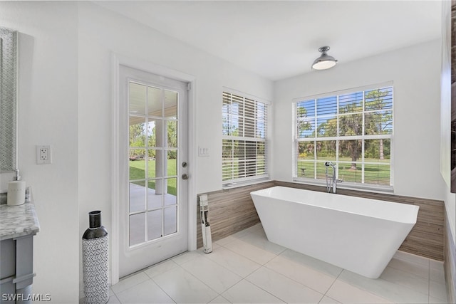 bathroom featuring tile patterned flooring and a bathing tub