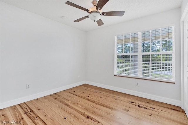 unfurnished room featuring light hardwood / wood-style floors and ceiling fan