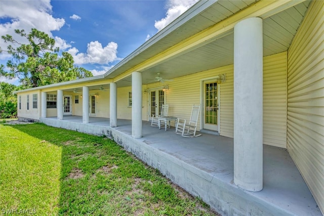 back of property featuring a yard