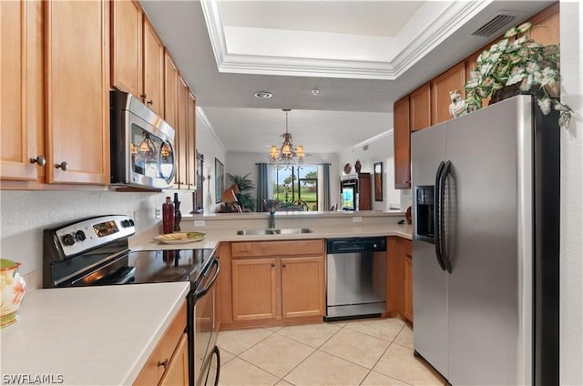 kitchen with light tile patterned flooring, a raised ceiling, sink, ornamental molding, and stainless steel appliances