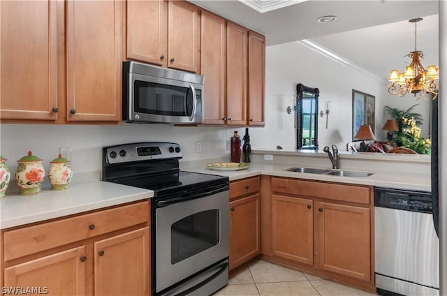 kitchen featuring sink, crown molding, light tile patterned floors, appliances with stainless steel finishes, and a notable chandelier