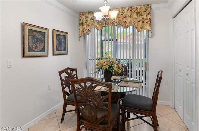 dining space with ornamental molding, light tile patterned flooring, and a chandelier