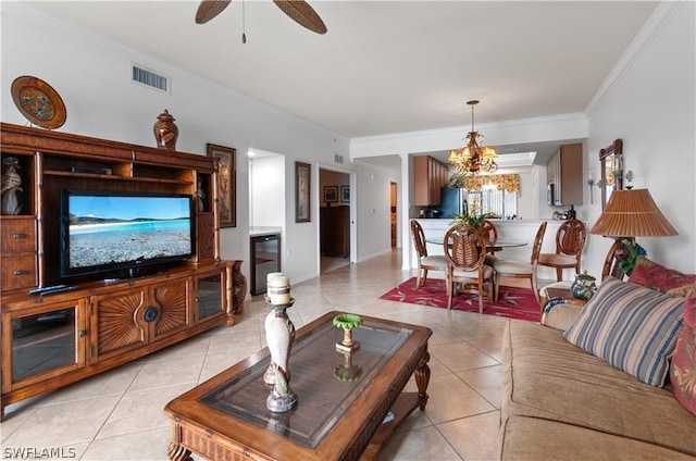 living room featuring ornamental molding, ceiling fan with notable chandelier, and light tile patterned floors