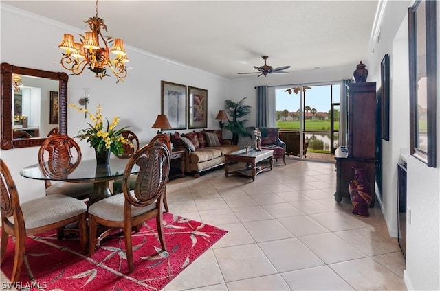 dining room with crown molding, ceiling fan with notable chandelier, and light tile patterned flooring