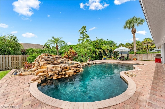 view of pool featuring a gazebo and a patio